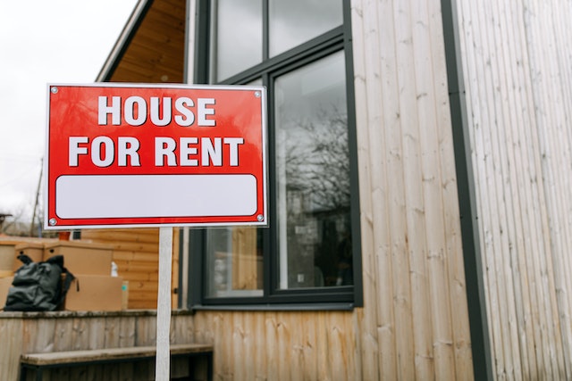 Red "House for Rent" sign